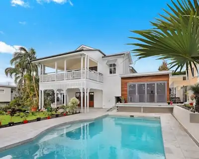 Construction workers building new home, showing framing and structural work in progress